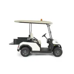 Toro Vista utility vehicle side view showcasing a cargo bed attachment, ideal for hauling and material transport