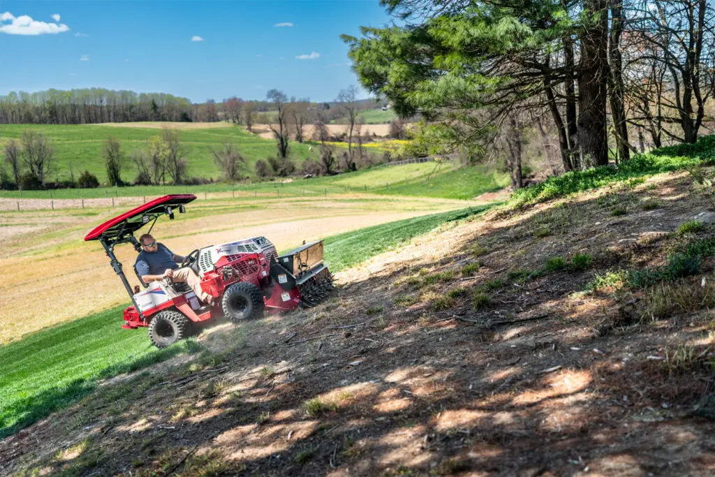 Ventrac Aera-Vator - The Ventrac effortlessly operates on slopes with the Aera-Vator attachment, seeding damaged areas of the lawn for revitalization.