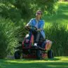 Lady mowing her lawns with a TORO eS3000 Battery Powered Ride-On Mower