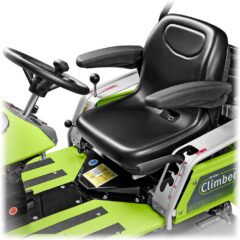 Close-up of the ride-on mower's comfortable black seat and steering wheel with control panel details