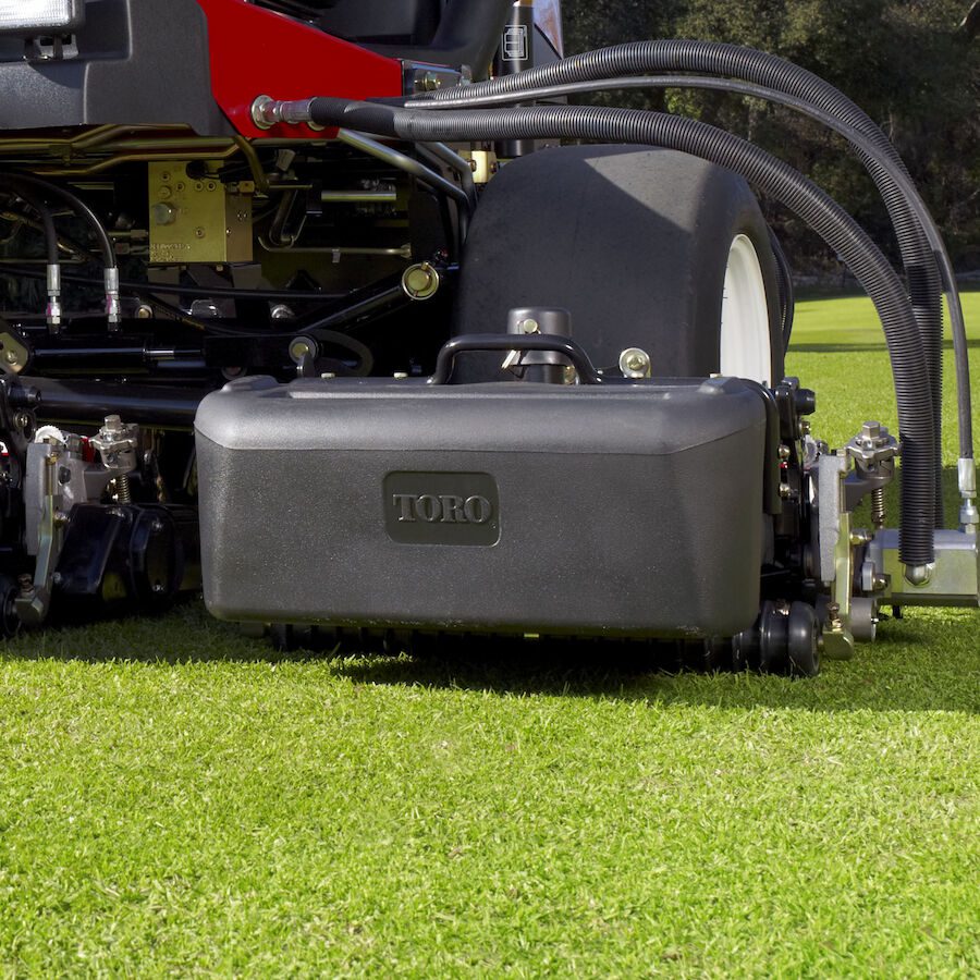 623_3c4699db-f751-46d7-b3bf-d5408b2f067c-7 Close-up of Toro cutting unit on grass, showcasing the 11-blade reel and robust design for precision mowing