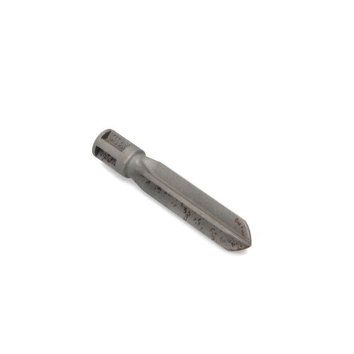 A gray cross tine tool, 4.50 inches long, with a tapered end and rust spots