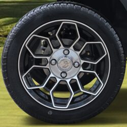 Close-up of a stylish alloy wheel with a unique design, showcasing the Tara Roadster's sporty aesthetic