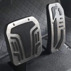 Close-up of the accelerator and brake pedals in a sleek electric golf cart interior