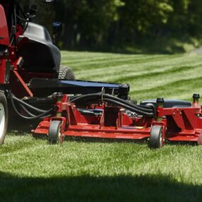 Close up of cutting deck on large area rotary mower at park