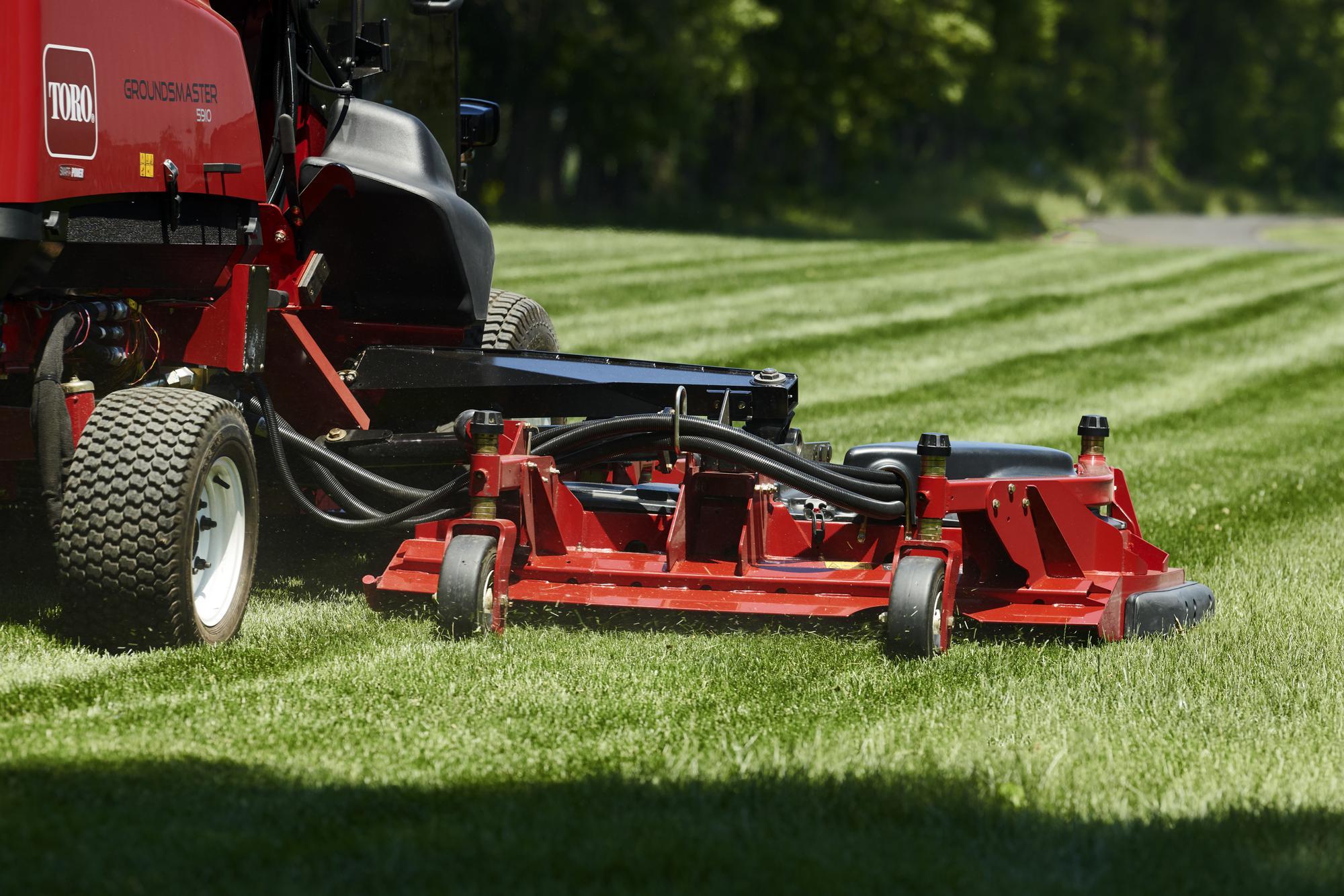 Close up of cutting deck commercial mower in new zealand on large area rotary mower at park
