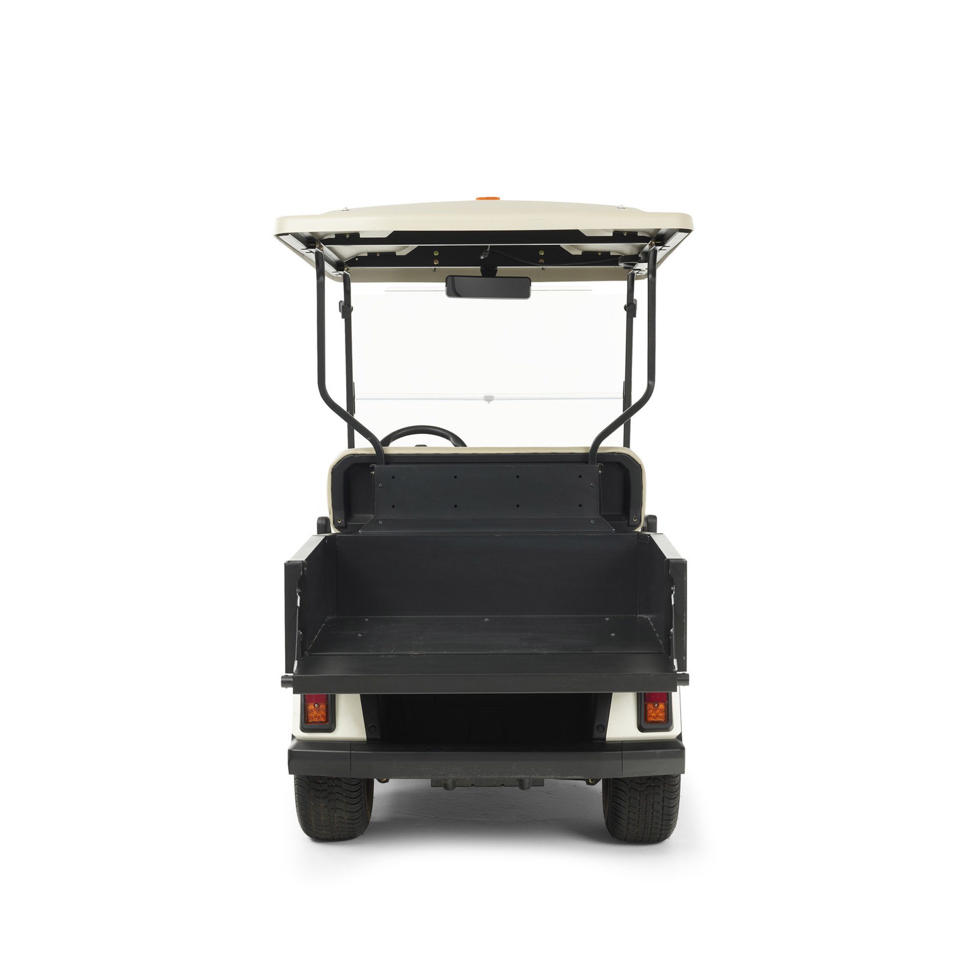 Toro Vista utility vehicle rear view with cargo bed attachment Rear view of Toro Vista utility vehicle showcasing its spacious cargo bed attachment for material transport