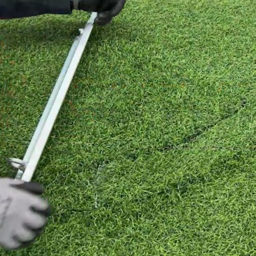 Cutting tool for circular cutting in artificial turf.