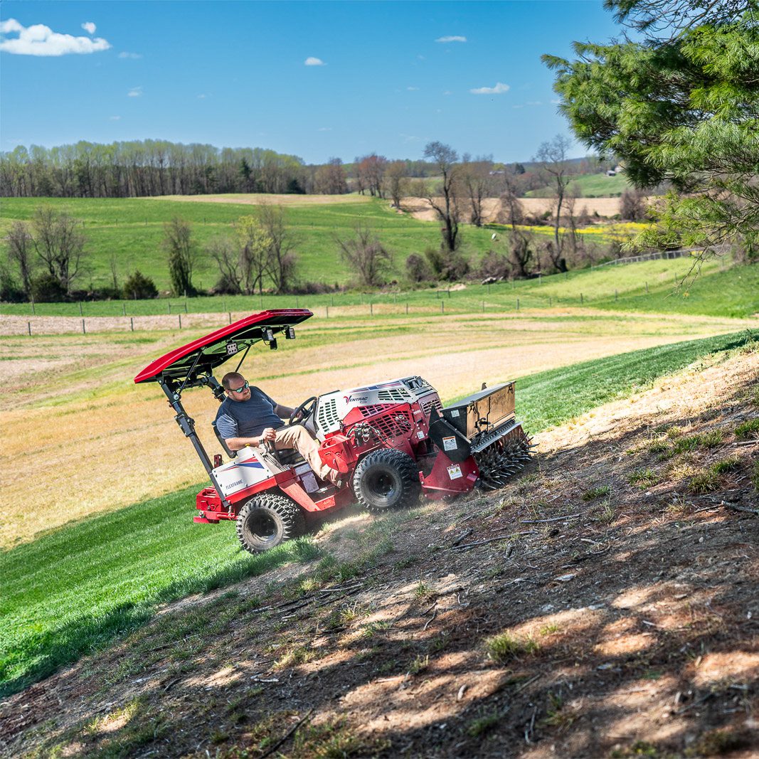 EA_Maryland_8106_2-2 Ventrac Aera-Vator - The Ventrac effortlessly operates on slopes with the Aera-Vator attachment, seeding damaged areas of the lawn for revitalization.