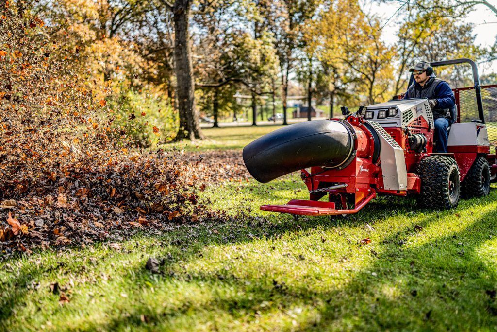 Ventrac Turbine Blower Attachment - blowing leaves in a public park