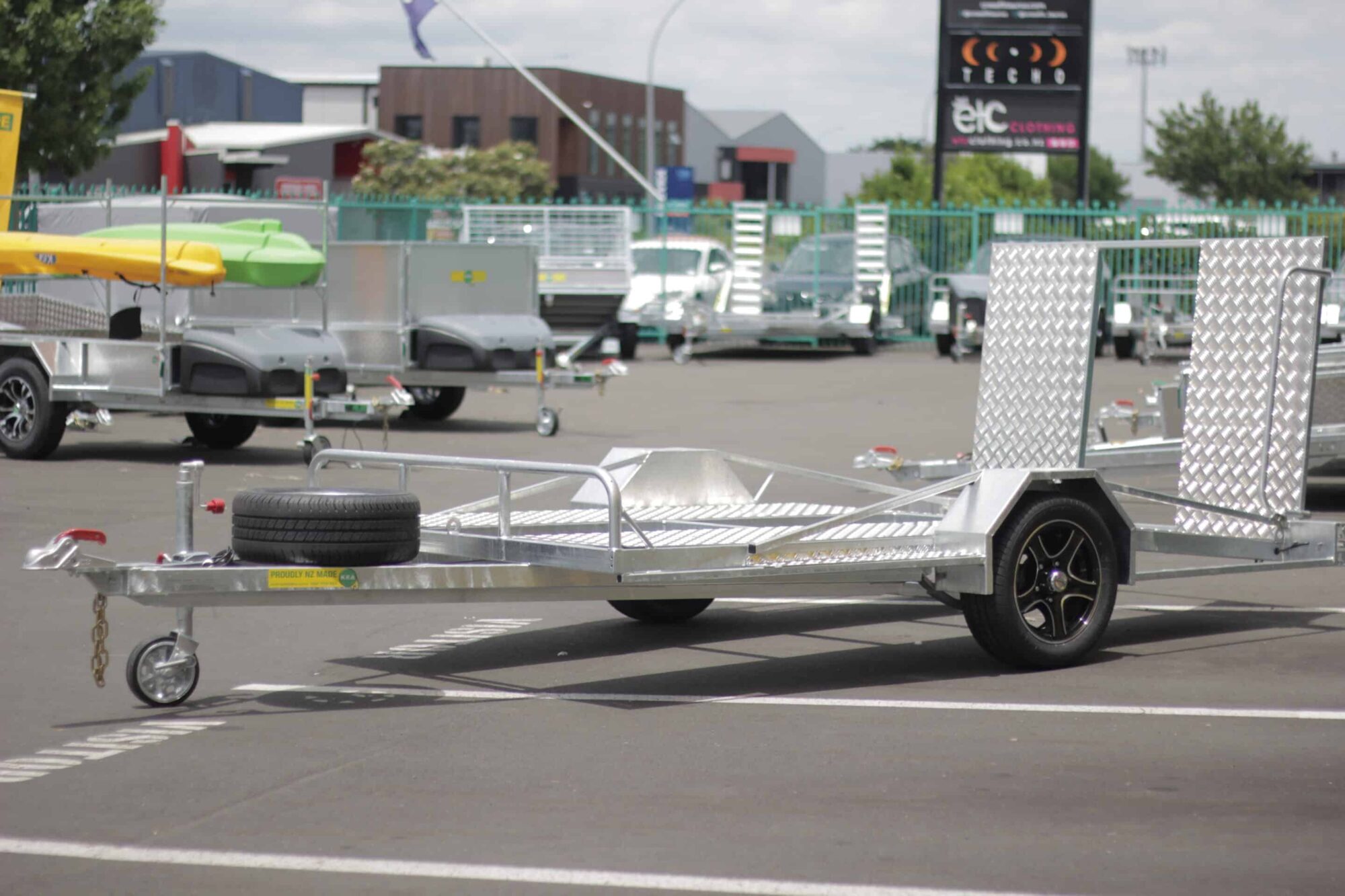 IMG_5833 A low-deck trailer with mag wheels and a light ramp for transporting golf carts