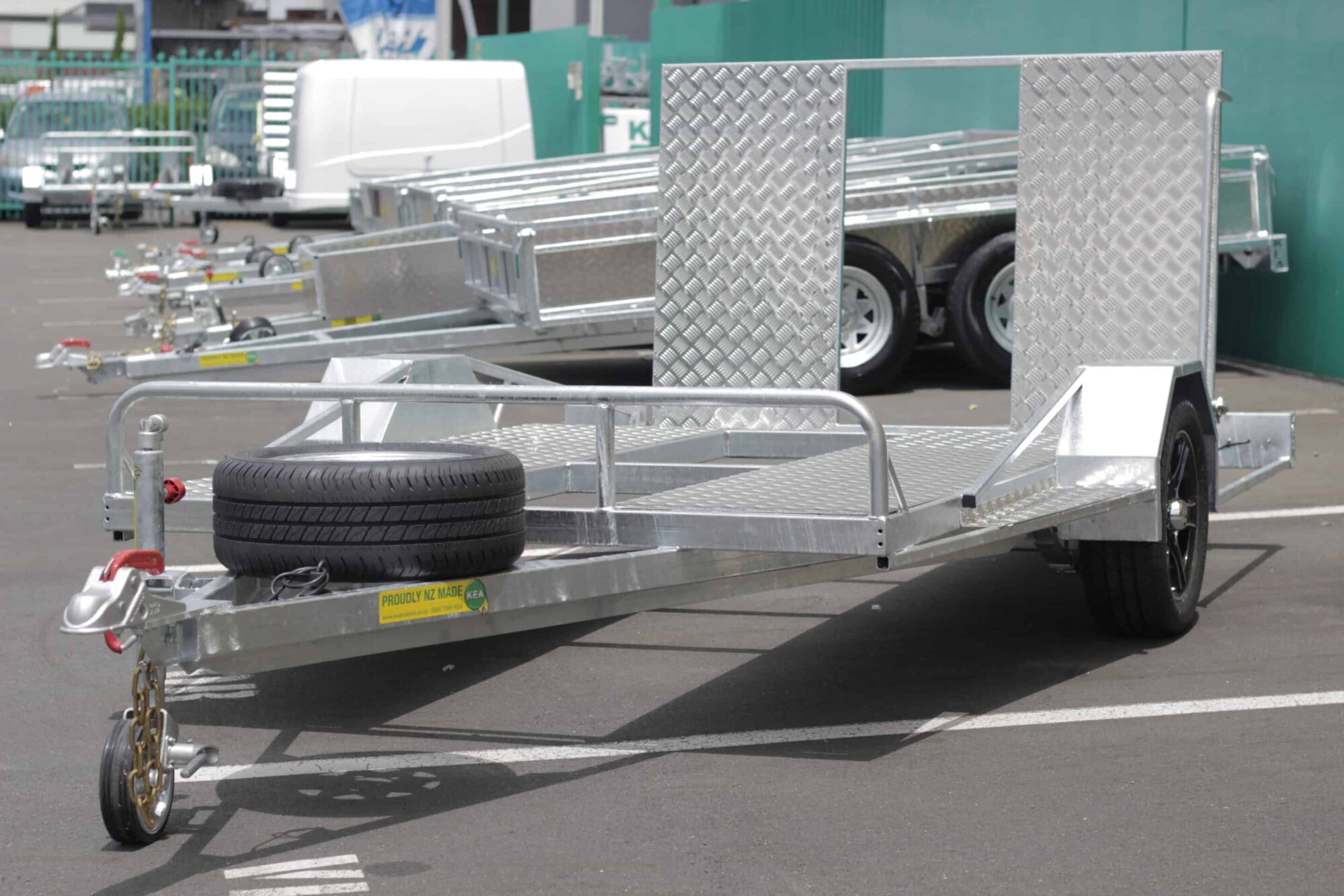 IMG_5839 Low-deck trailer for golf carts with a light ramp, mag wheels, and Duo-Fit coupling
