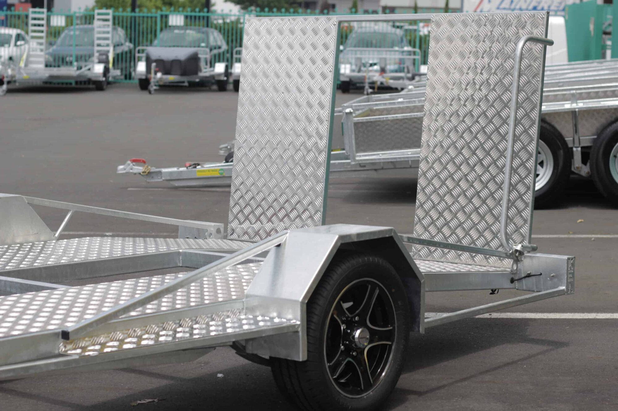 IMG_5854 A low-deck trailer with a light ramp, mag wheels, and a Duo-Fit coupling for golf cart transport