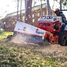 Ventrac 22" Stump Grinder Tractor Attachment - cutting through stump at university grounds