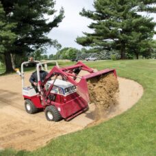 Ventrac Versa Loader Attachment - digging through golf course