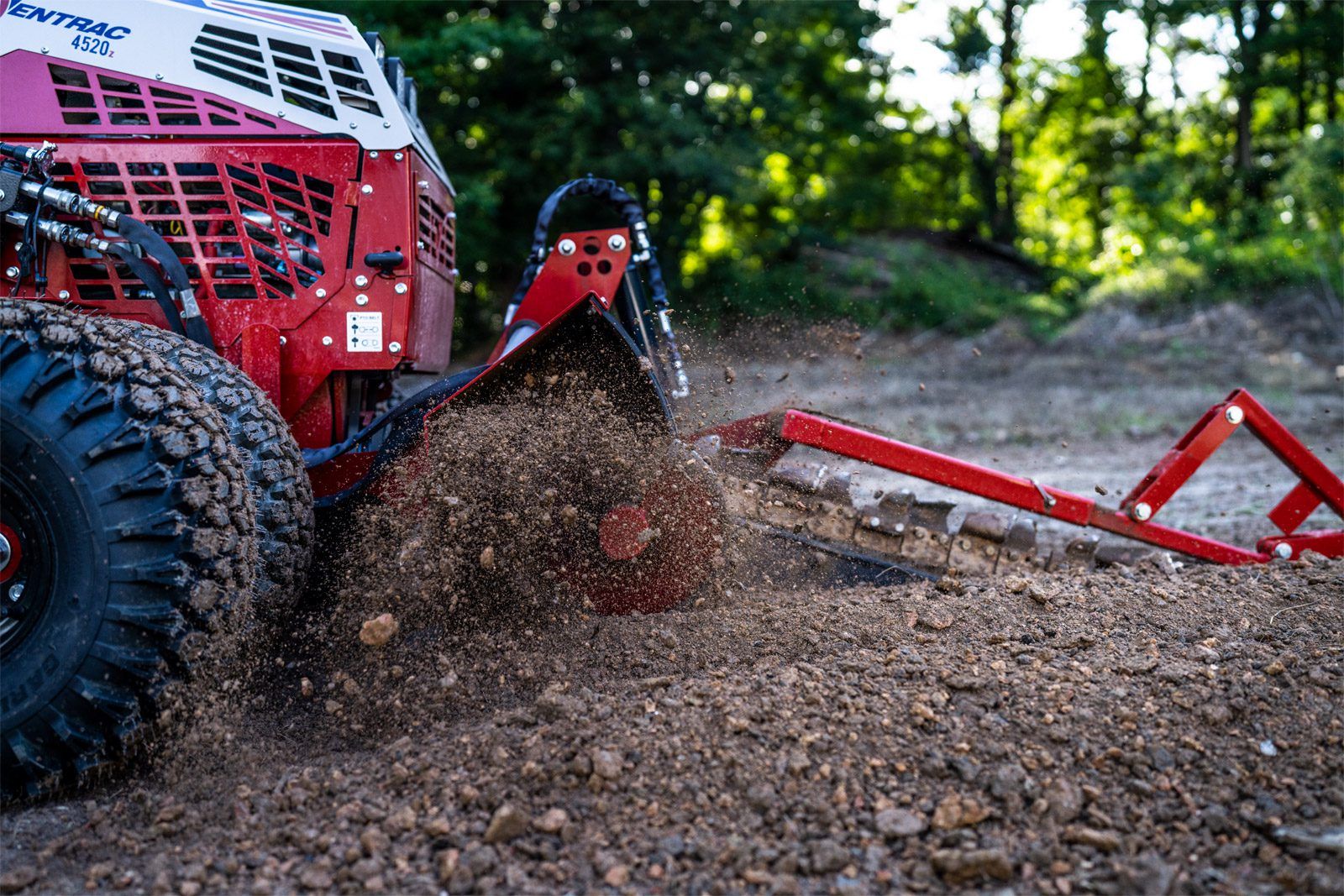 KY400 Ventrac Trencher Tractor Attachment Ventrac Trencher Tractor Attachment - close up of blades as they work