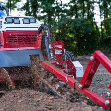 Ventrac Trencher Tractor Attachment - trenching in a forest