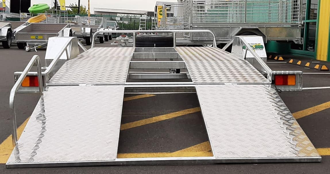 Low-Angle Low-deck trailer with a light ramp, mag wheels, and Duo-Fit coupling for transporting golf carts