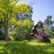 Man cutting grass with a TORO eS3000 Battery Powered Ride-On Mower