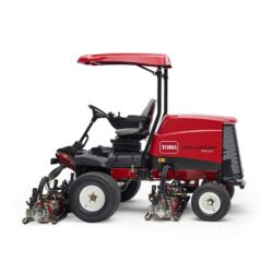 Side view of a red Toro ride-on mower showcasing cutting units and operator seat