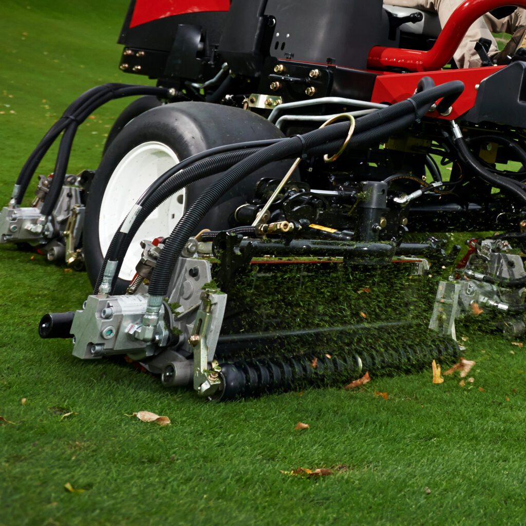 Close-up of Toro cutting unit with eight blades, designed for precise mowing on grass surfaces