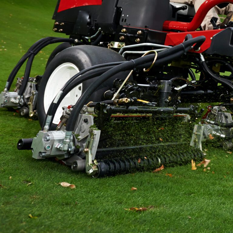 Close-up of Toro cutting unit with eight blades, designed for precise mowing on grass surfaces