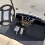 Interior view of a 2015 Yamaha PTV golf cart with beige seats and dashboard controls