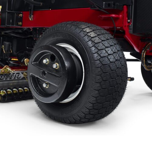 Close-up of a Toro Groundsmaster tire with a black wheel weight attached for added traction