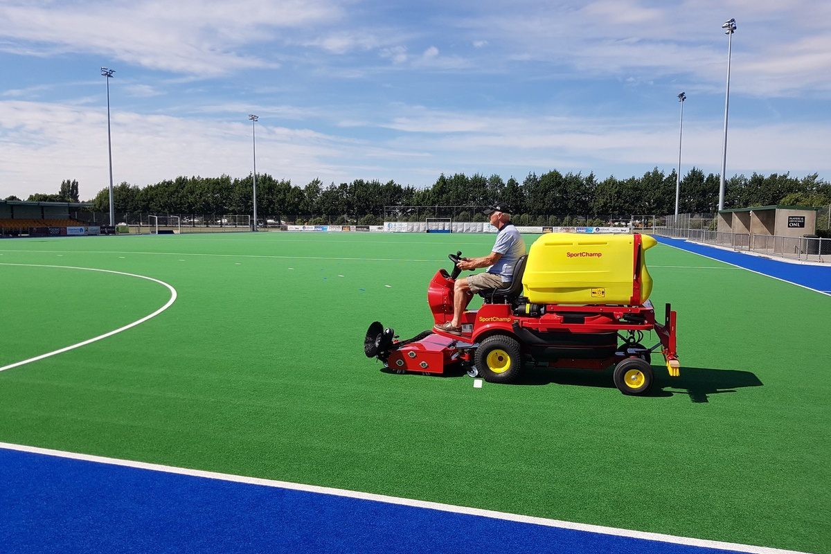 SMG SportChamp machine maintaining Canterbury Hockey artificial turf field