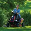 Lady mowing her lawns with a TORO eS3000 Battery Powered Ride-On Mower