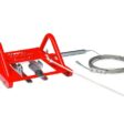 Red artificial turf line cutter with sharp blades and adjustable guide for precise cutting
