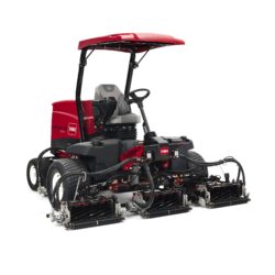 Red ride-on mower with dual cutting units and comfortable operator seat, showcasing advanced turf care technology