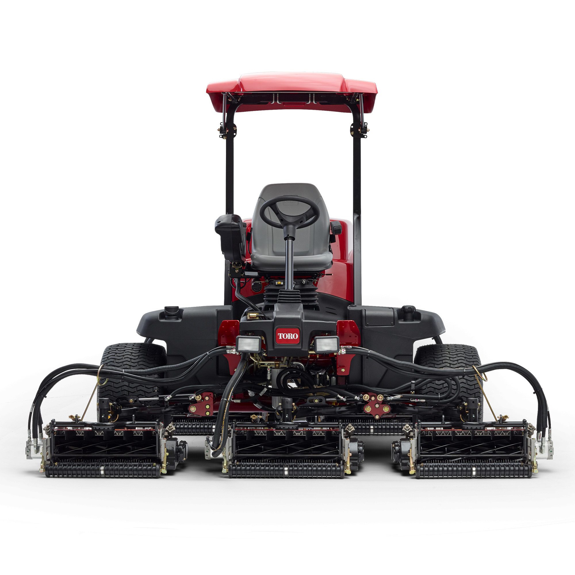 prodimg2 Front view of a Toro ride-on mower showcasing cutting units and operator seat in red and black