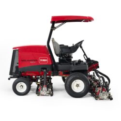 Side view of a red Toro ride-on mower showcasing cutting units and operator seat