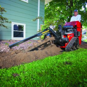 Trencher being used in backyard