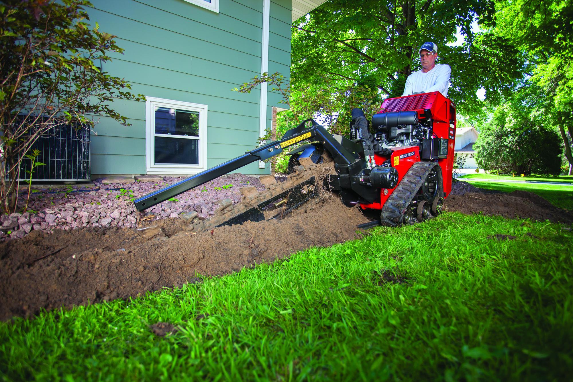 sw19_4296s_22984_trx300_0793 Trencher being used in backyard