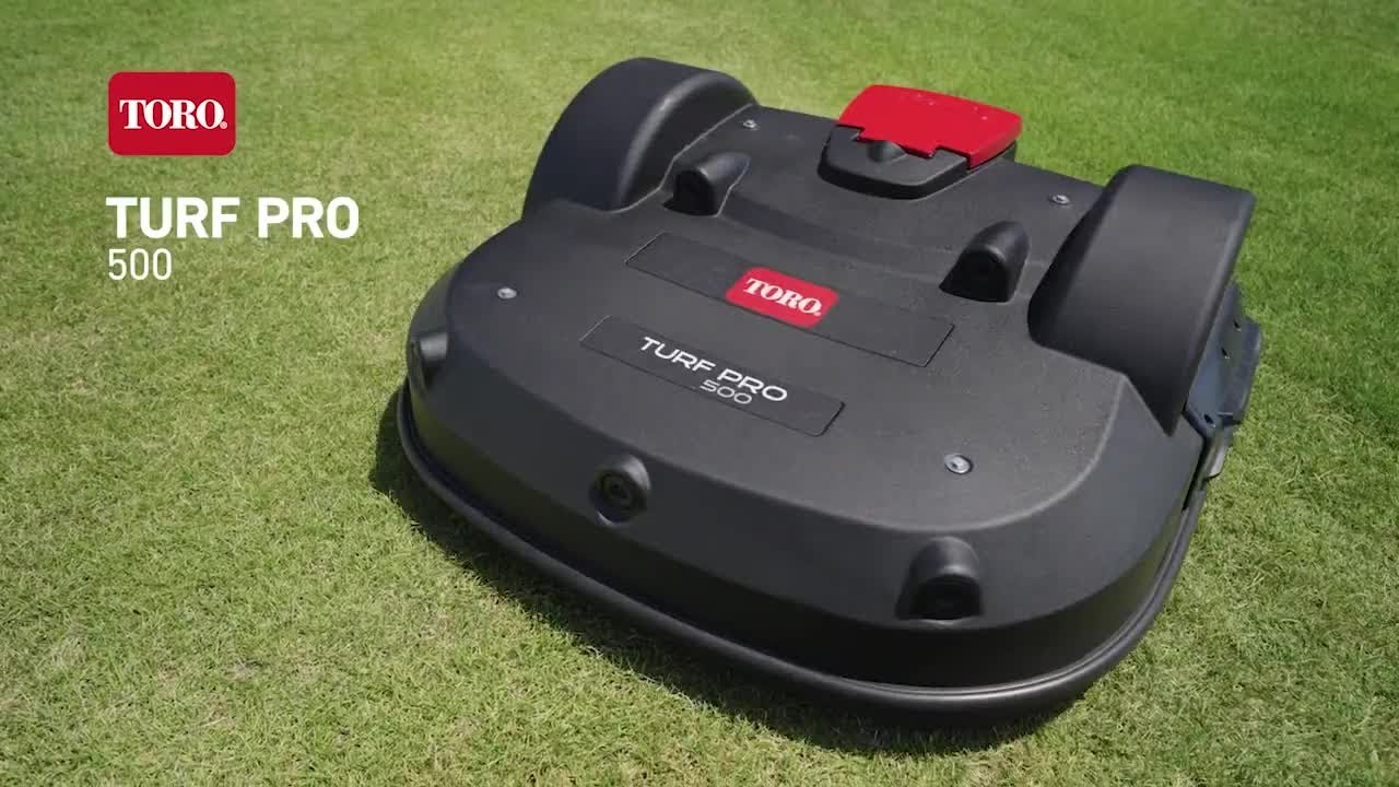A Toro Turf Pro 500 robotic mower on green grass, showcasing its sleek design and innovative features
